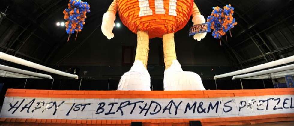 A 46 foot piñata in the form of an orange M&M candy, filled with thousands. Aug. 4, 2011 ( Sam Yeh/AFP )