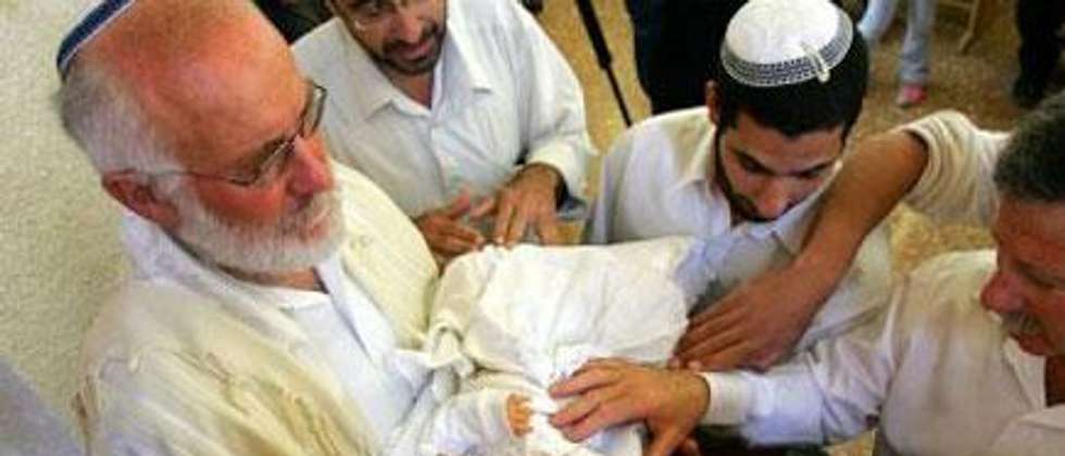 An eight-day-old Jewish baby undergoes circumcision ( David Furst/AFP )