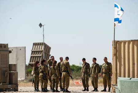 Israeli soldiers stand near an "Iron Dome" missile defence system -- designed to intercept and destroy incoming short-range rockets -- near the southern city of Ashkelon, on April 28, 2014 David Buimovitch (AFP)