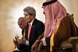 Saudi Foreign Minister Prince Saud al-Faisal (right) listens as John Kerry makes a statement to the press at King Khalid Airport in Riyadh on January 5, 2014 Brendan Smialowski (AFP)